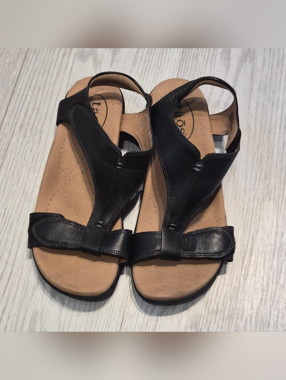 Taos Footwear Black Leather T-Strap Slingback Sandals with Tan Footbed